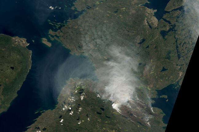 Satellite image showing parts of northern Canada covered in smoke 