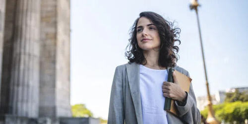 woman lawyer with a brown book