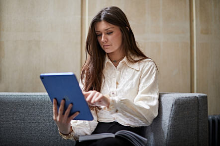 Person working on a tablet device.