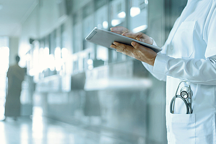 Healthcare and medicine. Medical and technology. Doctor working on digital tablet on hospital background