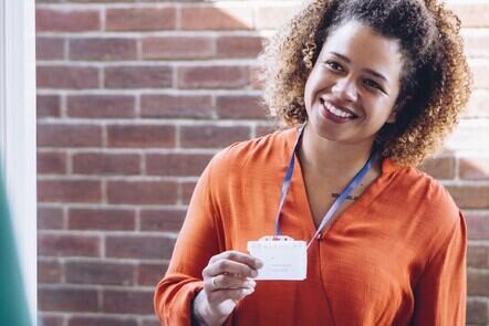 Healthcare Worker showing her badge