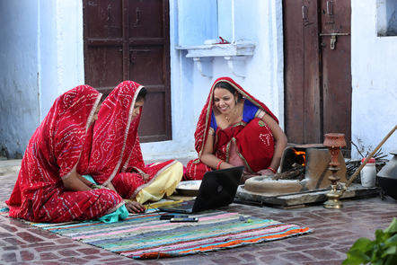 Women in India using a laptop