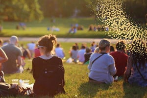 People sitting outside at a park