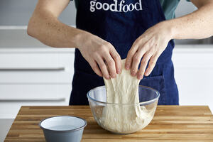 Person kneading bread dough