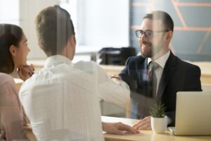 three business professionals having a discussion