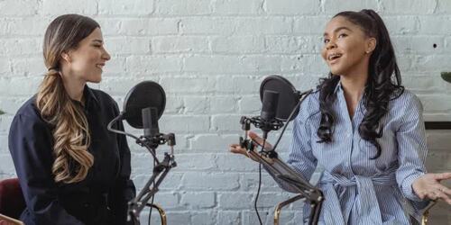 women talking in a recording studio